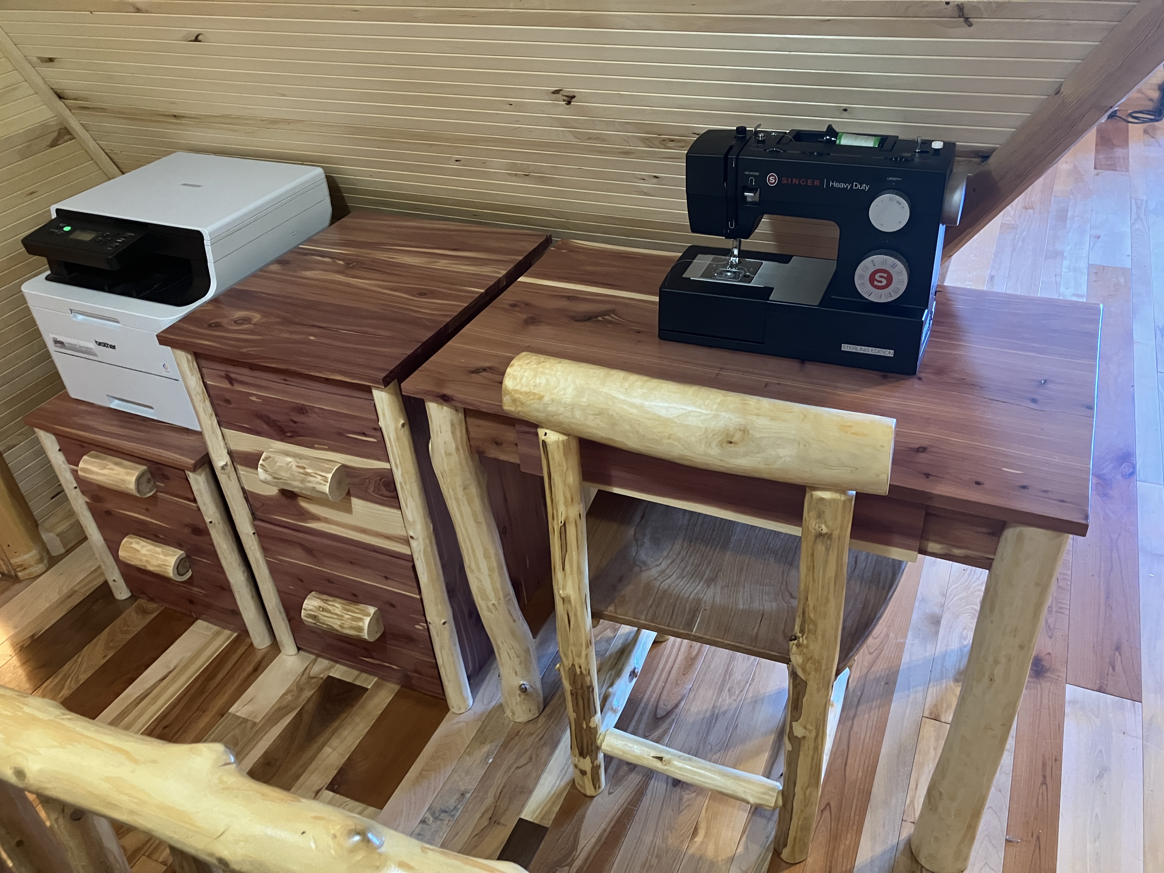 Cedar desk in cabin office setting with matching file cabinets