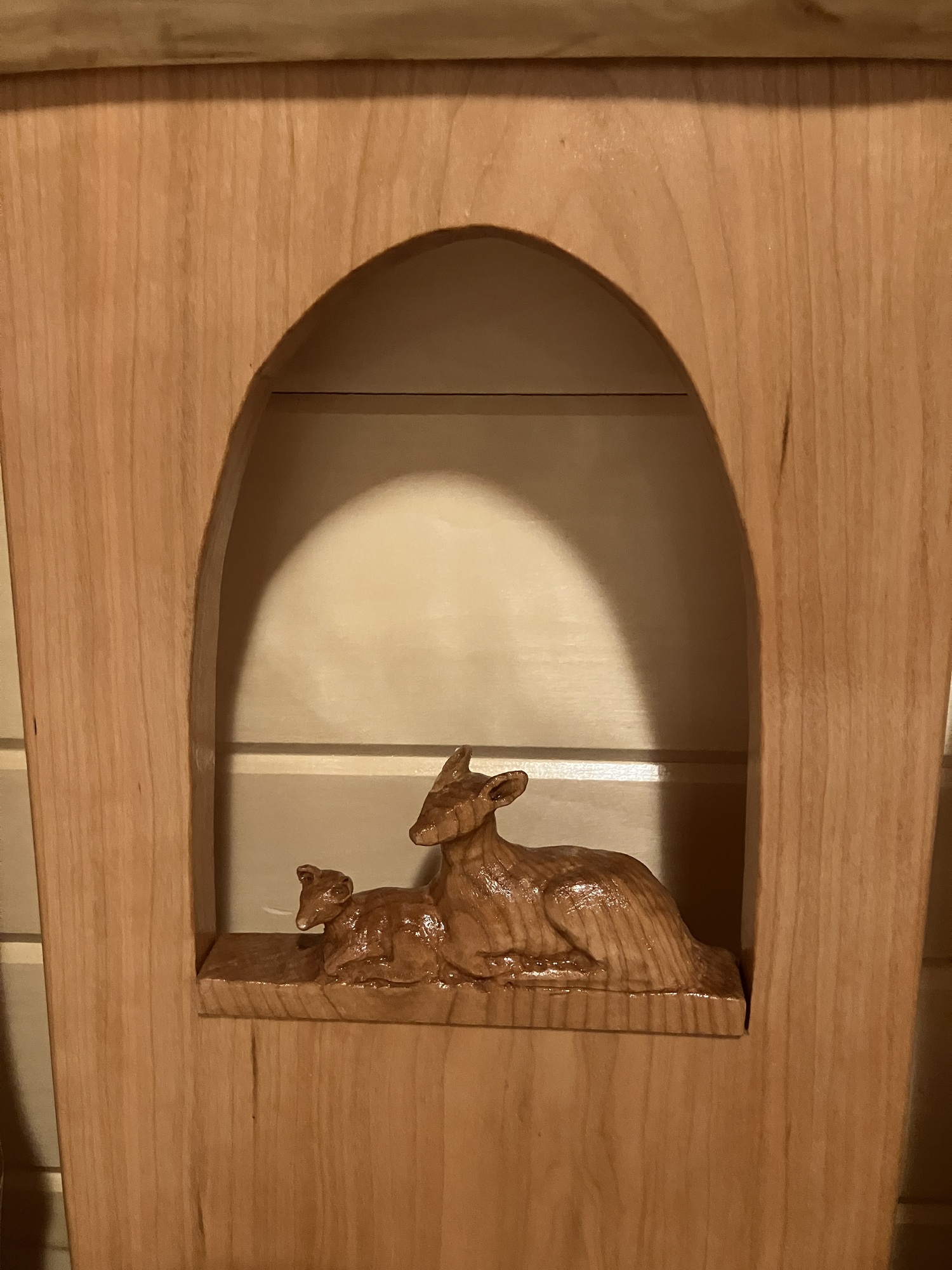 Close-up of mother deer and fawn carving showing fine detail