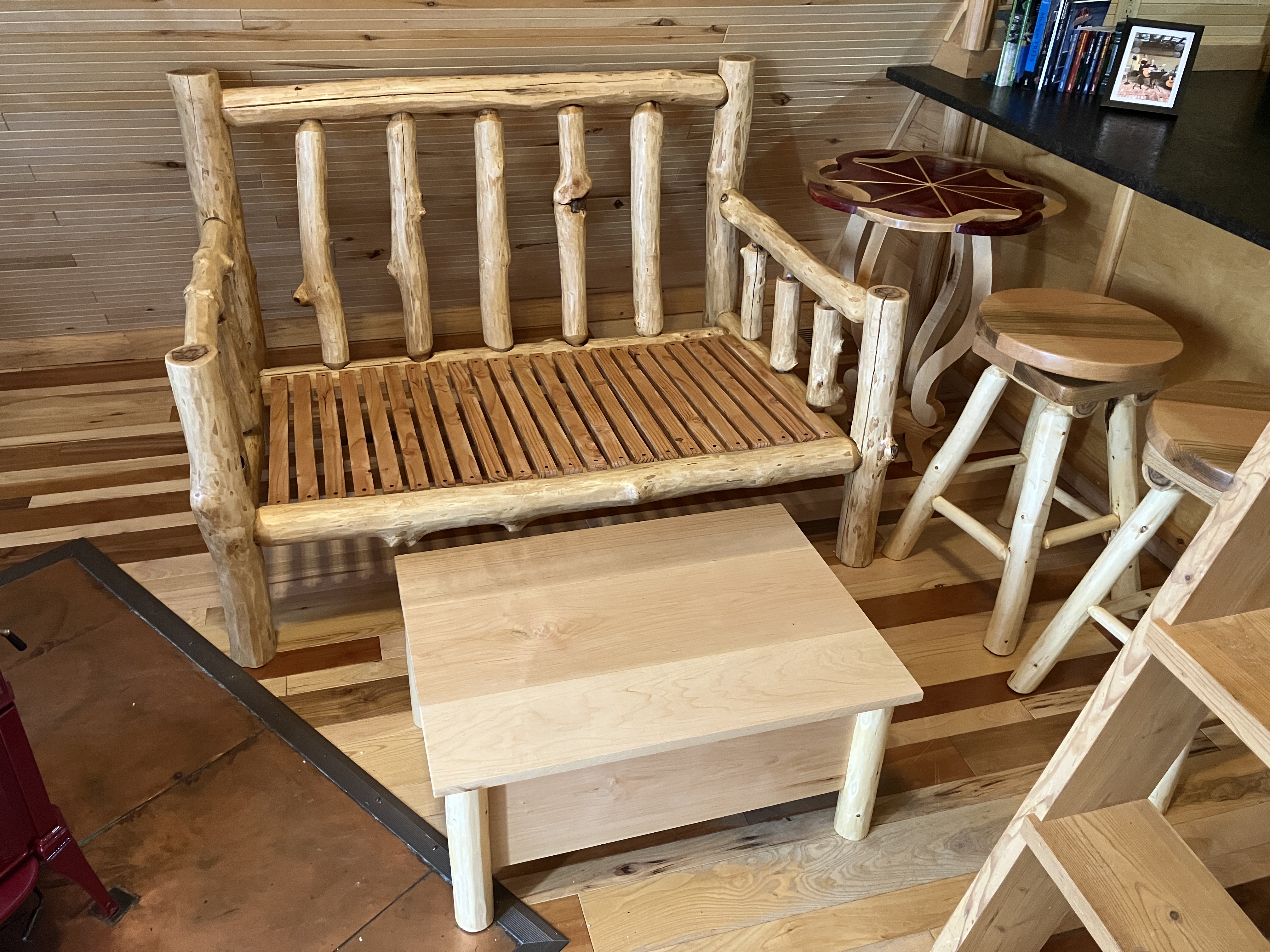 Complete rustic log furniture grouping with sofa, ottoman, table, and stools