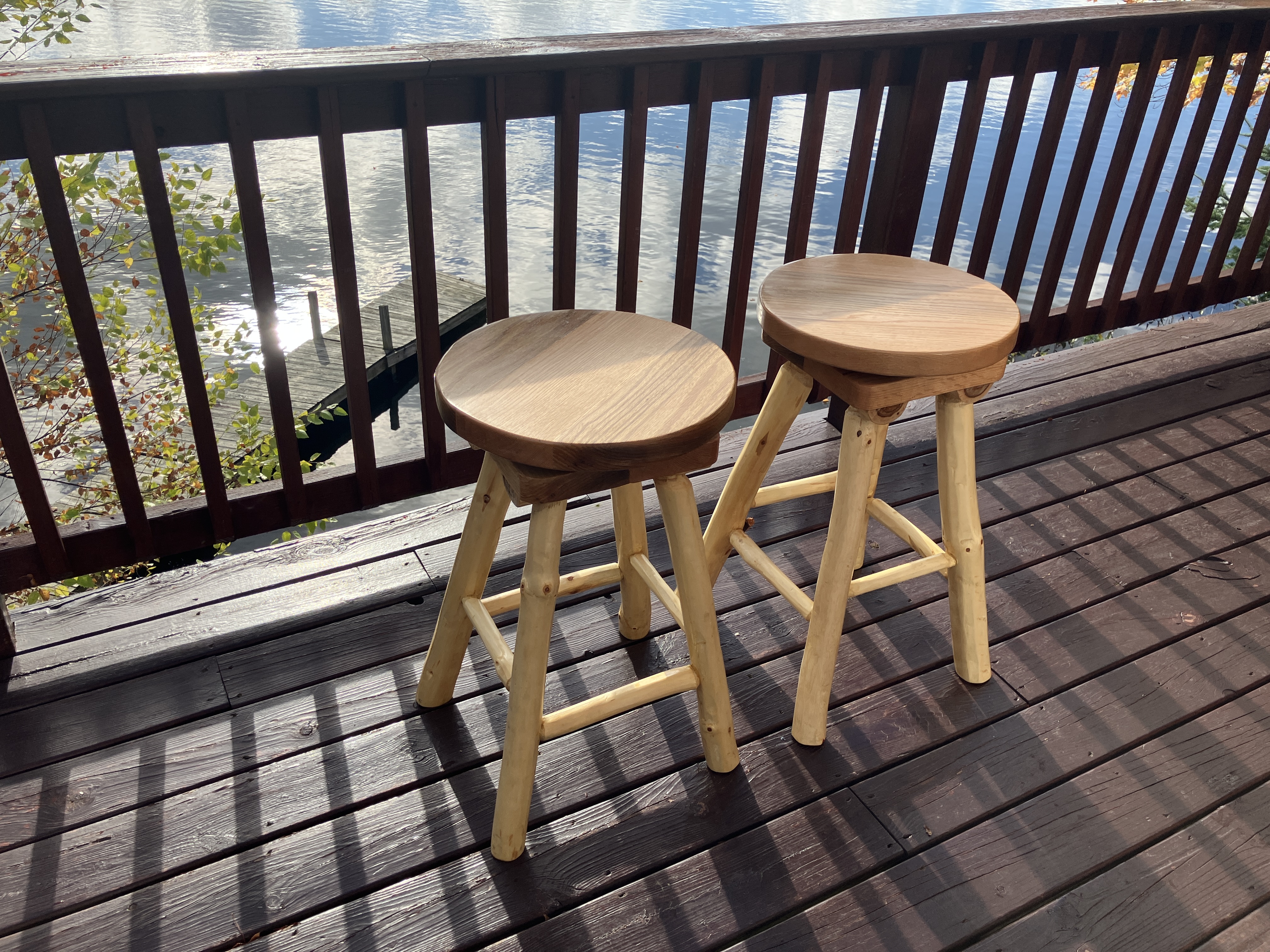 Pair of swivel log stools in an outdoor setting