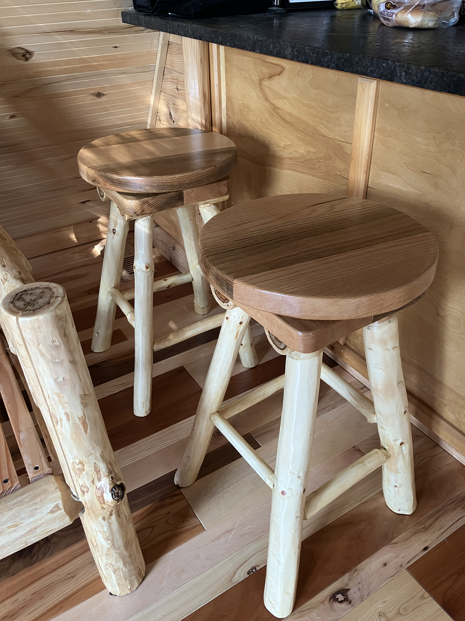 Swivel log stool next to the kitchen bar